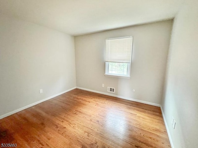 empty room featuring wood-type flooring