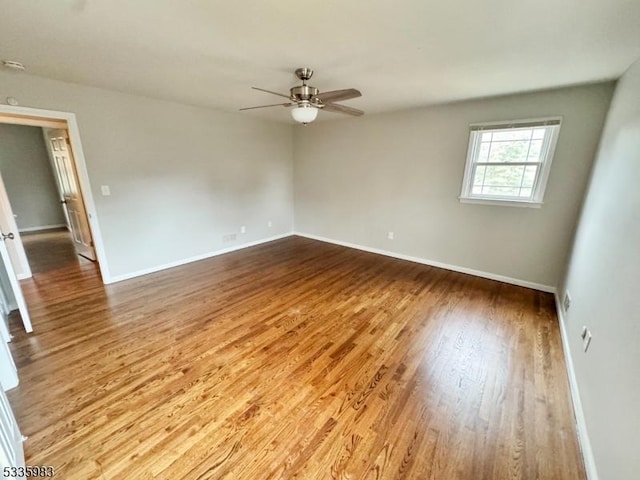 unfurnished room featuring light hardwood / wood-style floors and ceiling fan