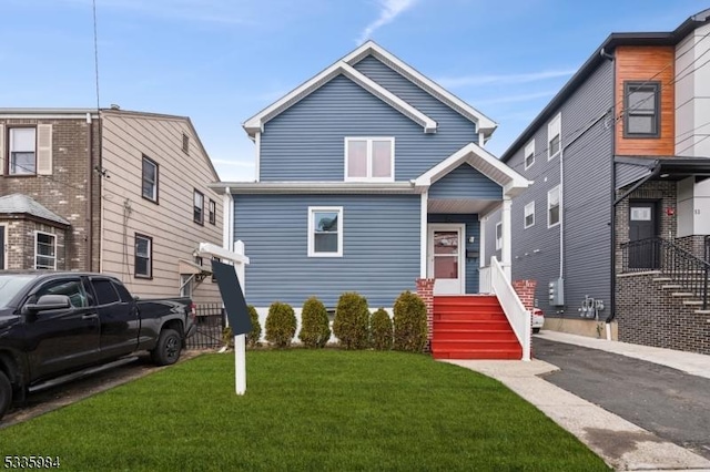 view of front of house with a front lawn