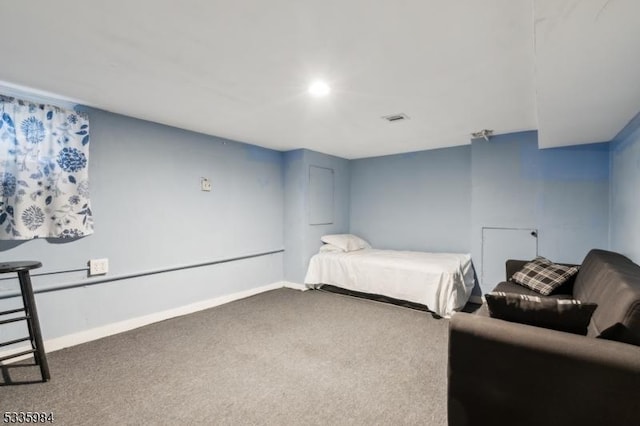 bedroom with carpet, visible vents, and baseboards