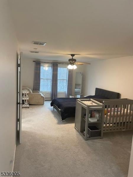 bedroom featuring ceiling fan and carpet flooring