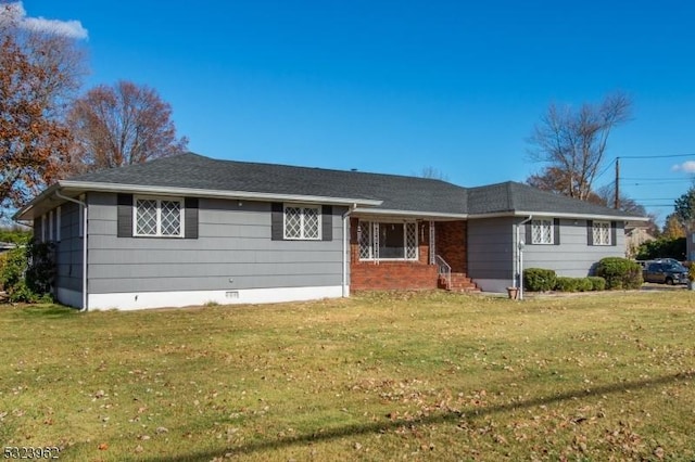 ranch-style house featuring a front lawn