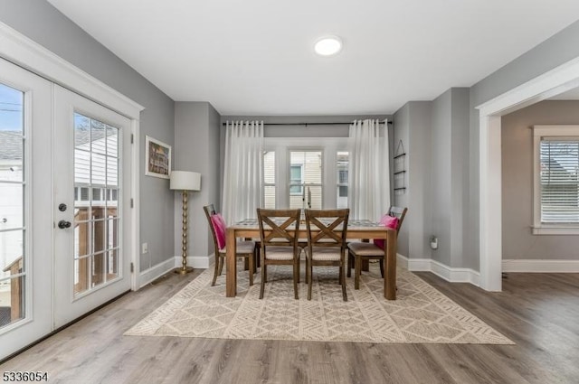 dining room featuring light hardwood / wood-style floors and french doors