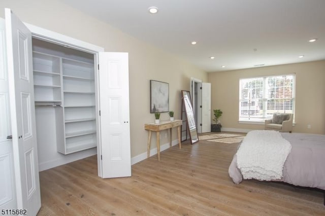 bedroom with light hardwood / wood-style flooring