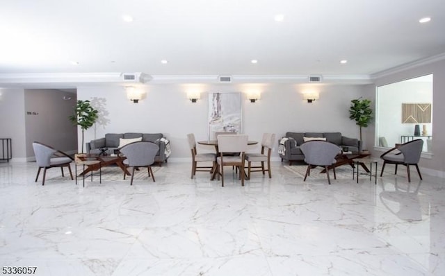 dining room featuring ornamental molding