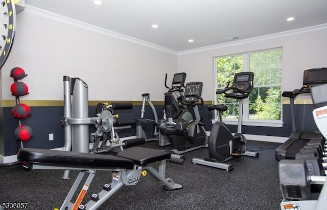 workout area with crown molding