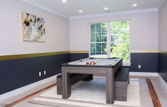 game room with ornamental molding, pool table, and light hardwood / wood-style flooring