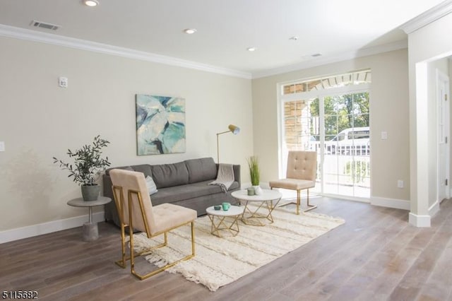 living room featuring ornamental molding and hardwood / wood-style floors