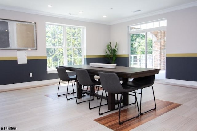 dining area with crown molding and a wealth of natural light