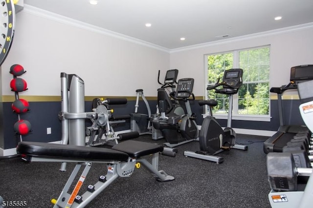 exercise room featuring ornamental molding