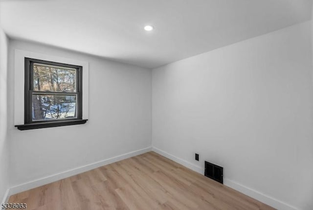 spare room with light wood-type flooring