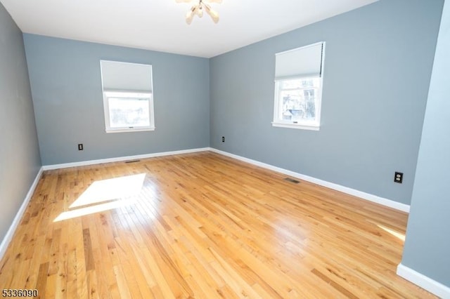 spare room featuring hardwood / wood-style flooring