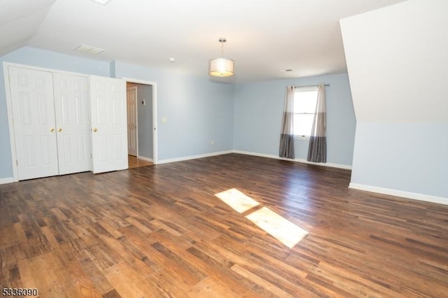 spare room with dark hardwood / wood-style flooring