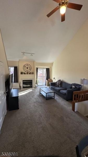 unfurnished living room featuring lofted ceiling and carpet floors