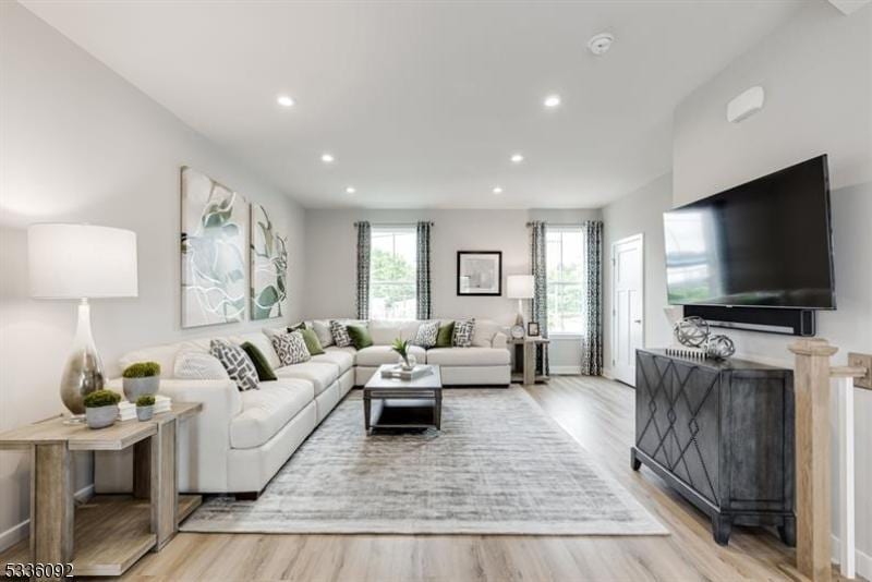 living room with light hardwood / wood-style flooring