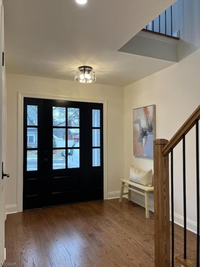 entryway with dark wood-type flooring