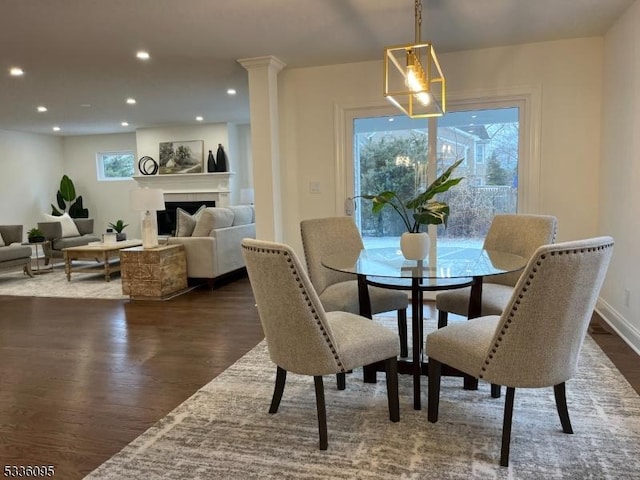 dining area featuring dark wood-type flooring