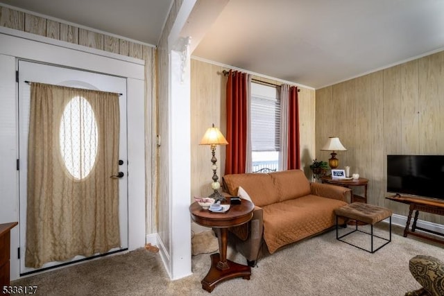 entrance foyer with carpet and crown molding