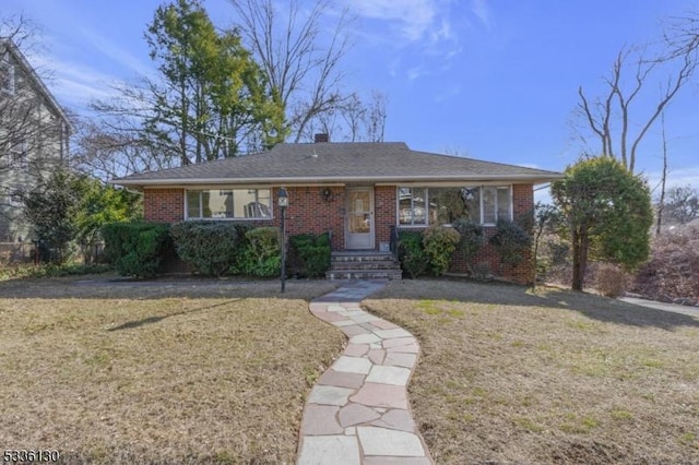 ranch-style home with a front yard