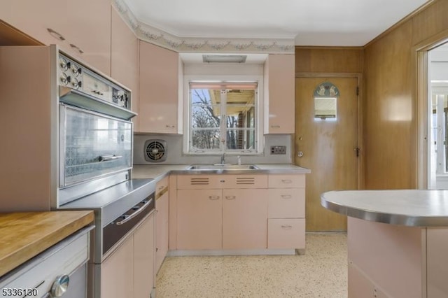 kitchen with sink and cream cabinetry