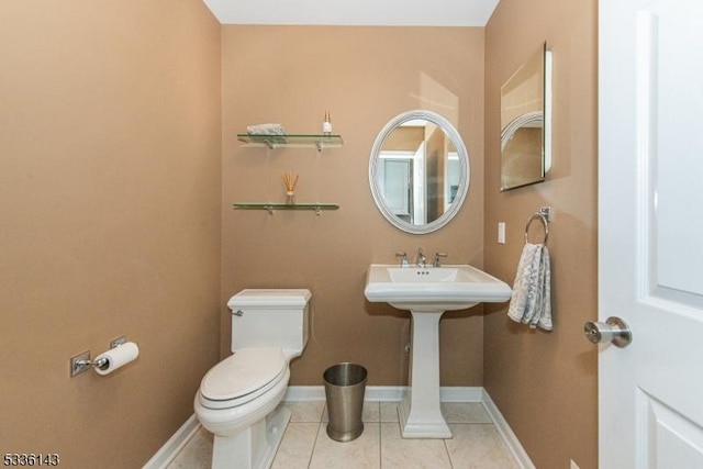 bathroom featuring tile patterned flooring and toilet