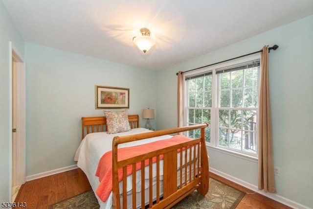 bedroom with hardwood / wood-style floors