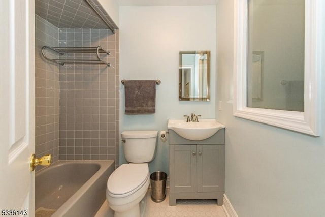 full bathroom with tiled shower / bath combo, vanity, tile patterned flooring, and toilet