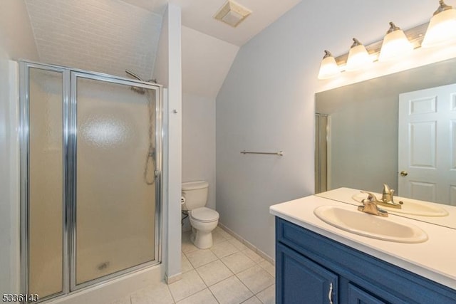 bathroom featuring tile patterned flooring, vanity, vaulted ceiling, toilet, and walk in shower