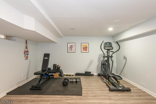 exercise area featuring hardwood / wood-style flooring