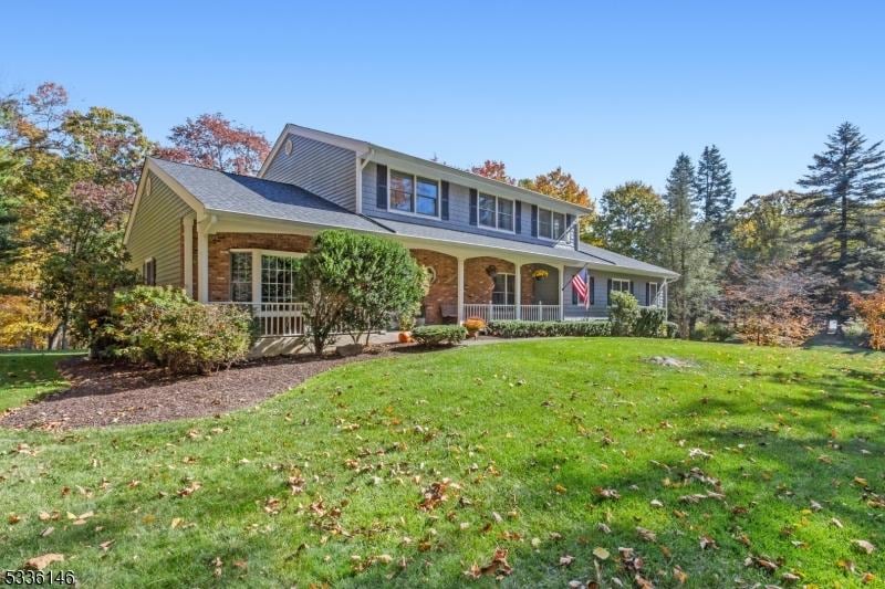 view of front of home with a front lawn and a porch