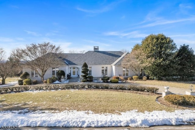 ranch-style home featuring a lawn