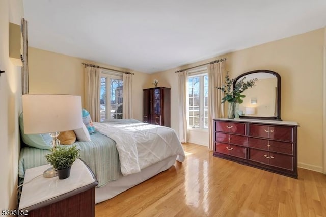 bedroom with light hardwood / wood-style flooring