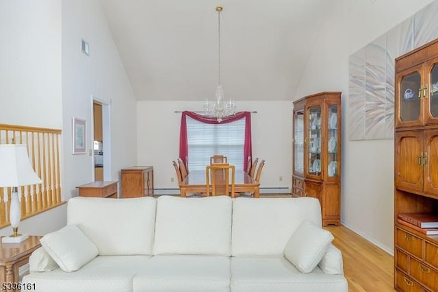 living room featuring an inviting chandelier, light hardwood / wood-style flooring, high vaulted ceiling, and a baseboard radiator