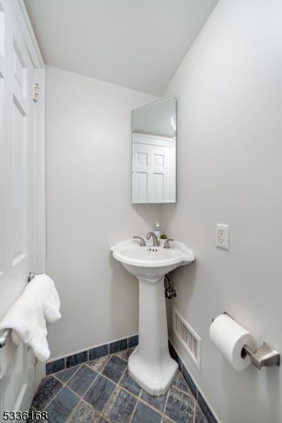 bathroom with vaulted ceiling