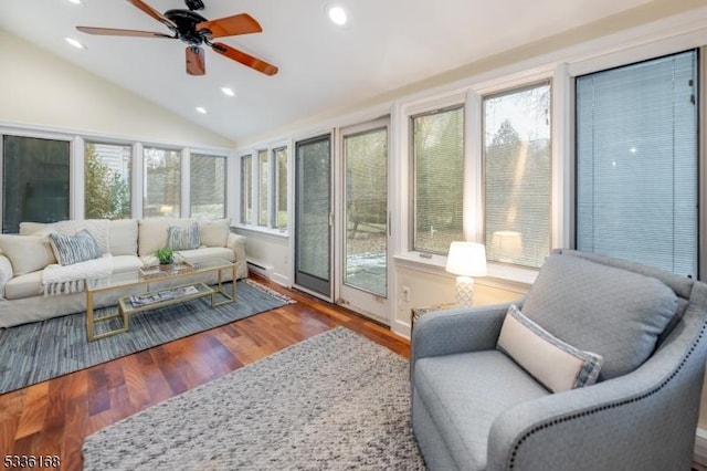 sunroom / solarium with lofted ceiling and ceiling fan