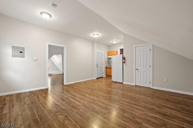 bonus room with hardwood / wood-style flooring, lofted ceiling, and electric panel