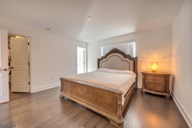 bedroom featuring dark wood-type flooring