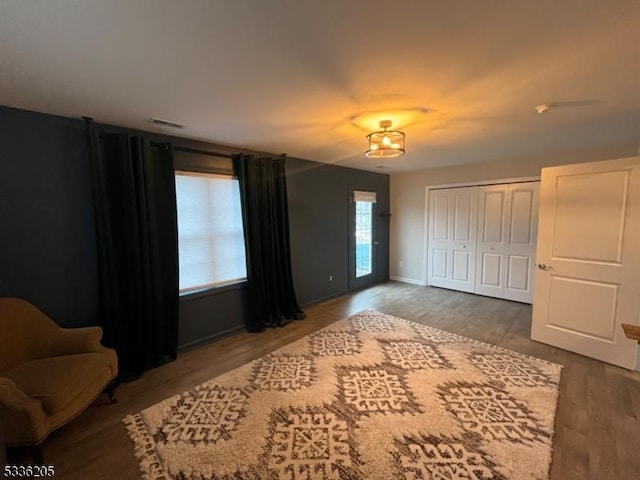 bedroom with hardwood / wood-style flooring and a closet