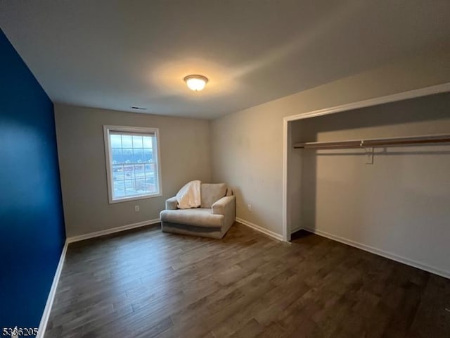 unfurnished room featuring dark wood-type flooring