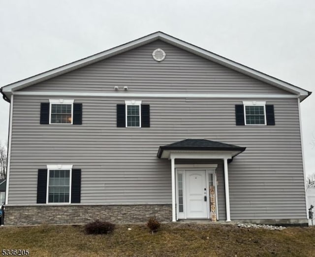 front facade with a front yard