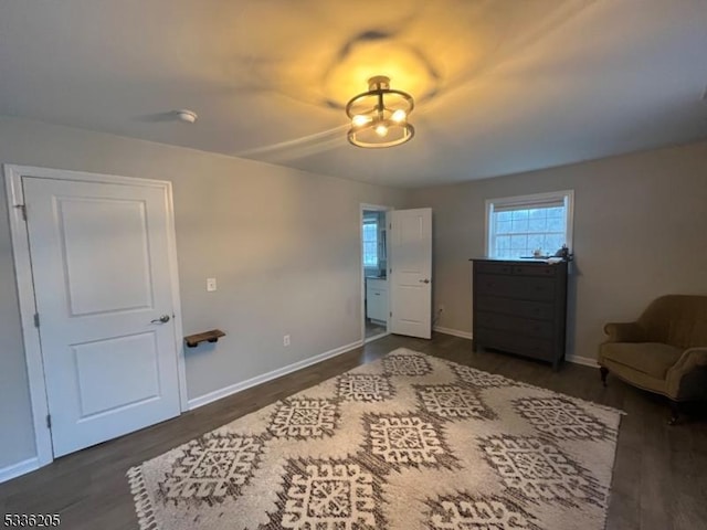 bedroom with dark wood-type flooring