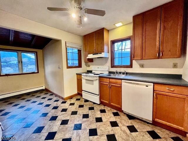 kitchen with a baseboard heating unit, white appliances, sink, and ceiling fan