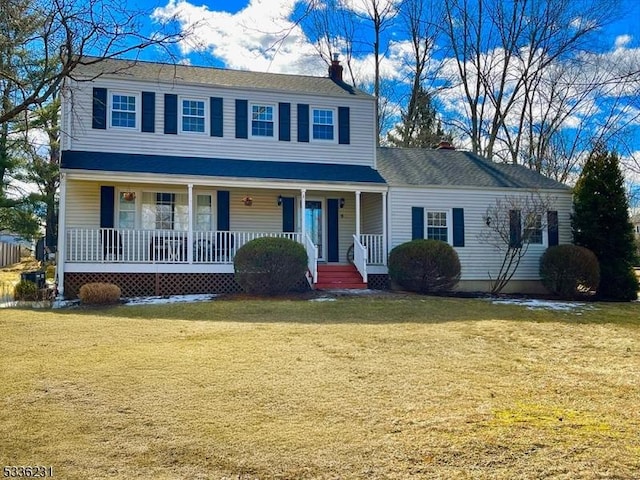 view of front of home featuring a front lawn and covered porch