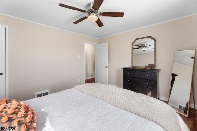 bedroom featuring visible vents, baseboards, and ornamental molding