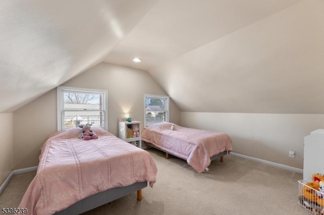 bedroom featuring lofted ceiling, carpet flooring, and baseboards