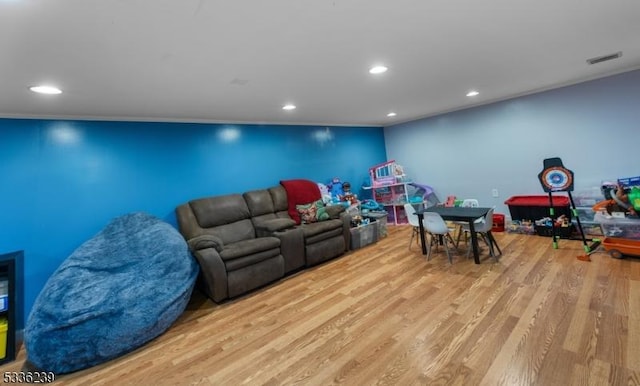 playroom featuring visible vents, recessed lighting, and wood finished floors