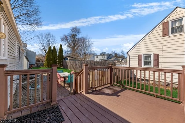 deck featuring a fenced backyard and a residential view