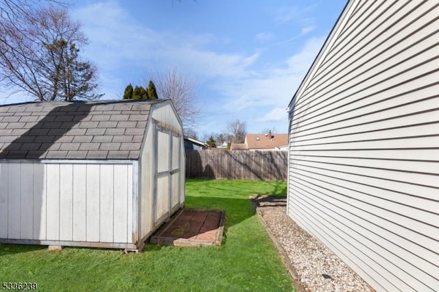 view of shed featuring a fenced backyard