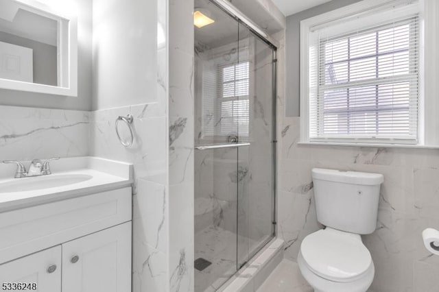 bathroom featuring vanity, toilet, and walk in shower