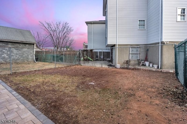 view of yard at dusk